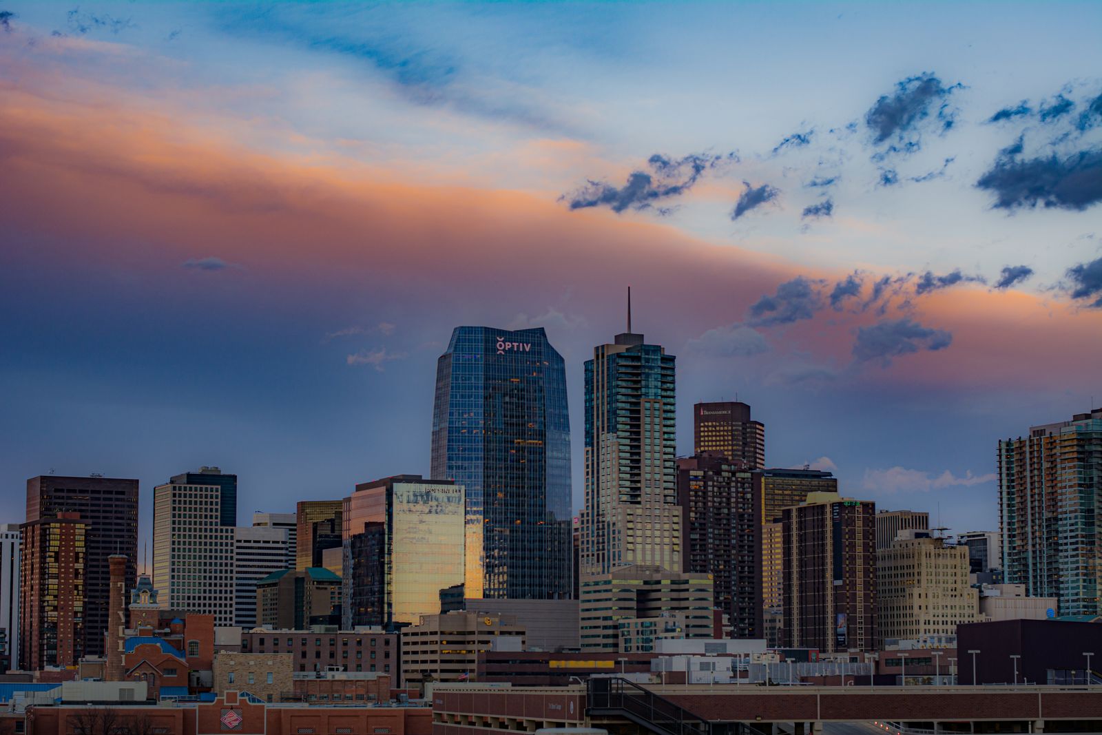 Denver skyline at sunset, center of the Summit Peak service area