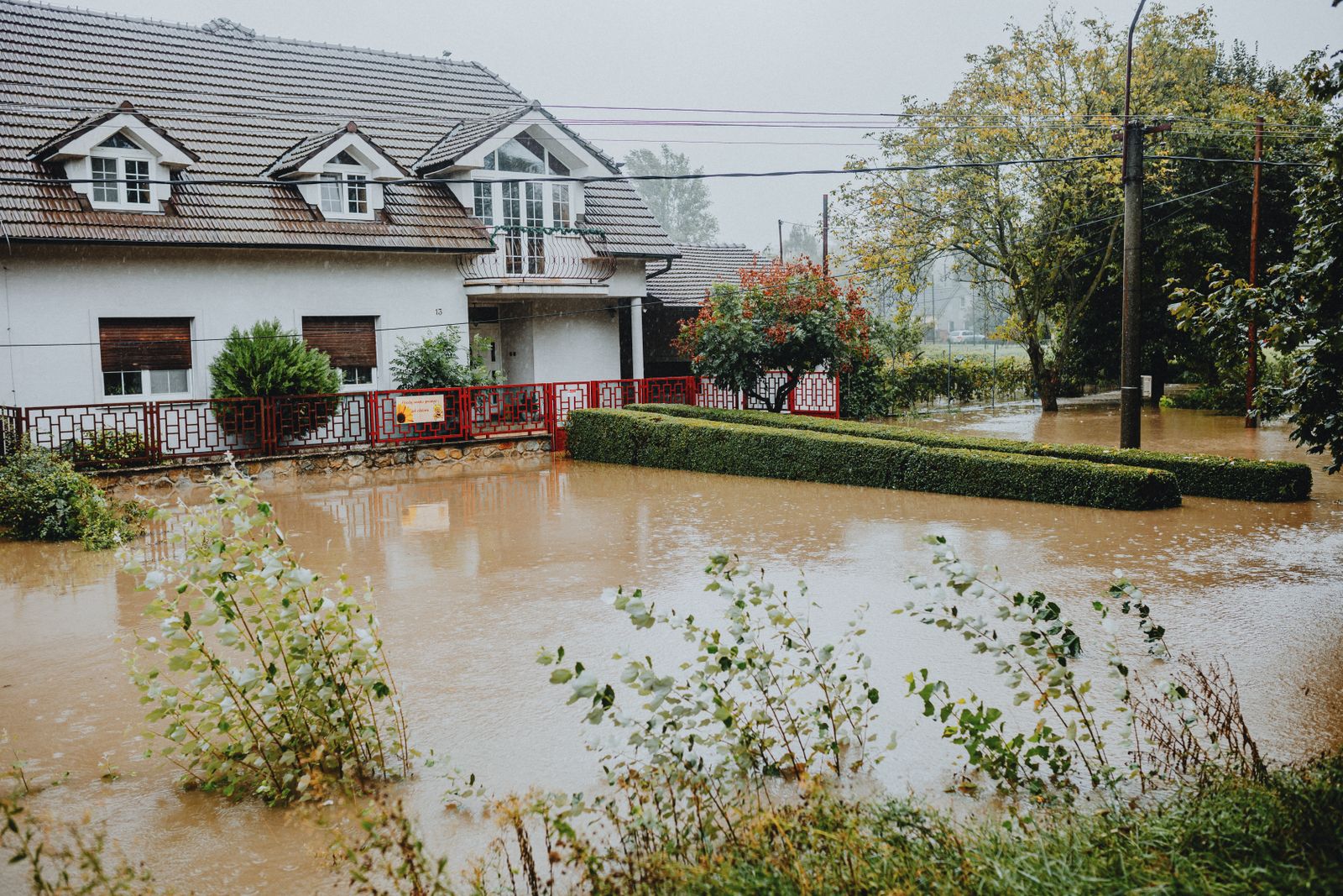 Home surrounded by storm water after heavy rain