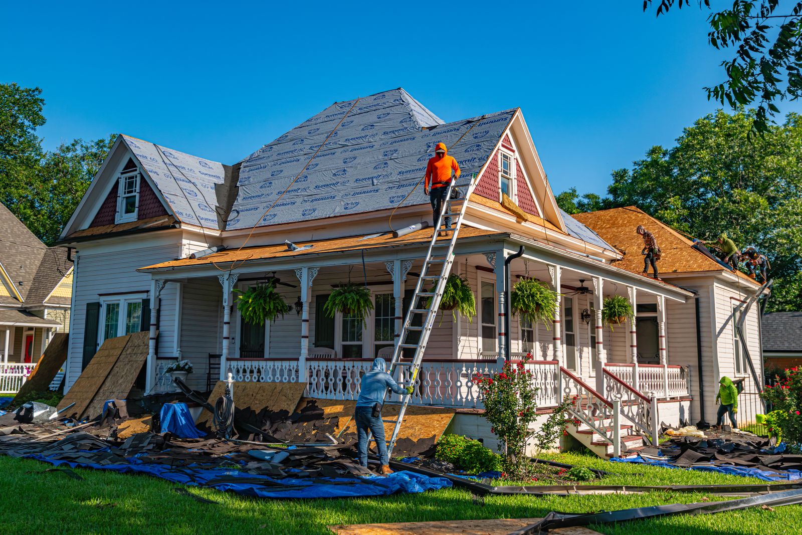 Summit Peak crew tearing off the old shingles on a Berkeley bungalow